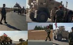 Un convoi militaire US à un checkpoint militaire syrien