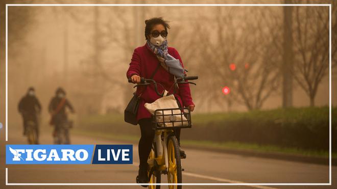 Pékin suffoque sous une épaisse couche de pollution et une tempête de sable